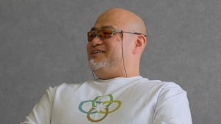 Close up of Hideki Kamiya in white Clovers jumper smiling