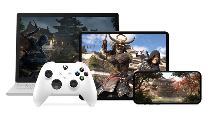 Images from Assassin's Creed Shadows displayed on a laptop screen, tablet, and phone, with an Xbox controller nearby.