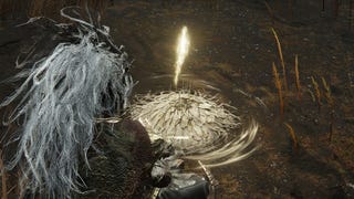 A warrior sits at a Site of Grace in Shadow of the Erdtree.