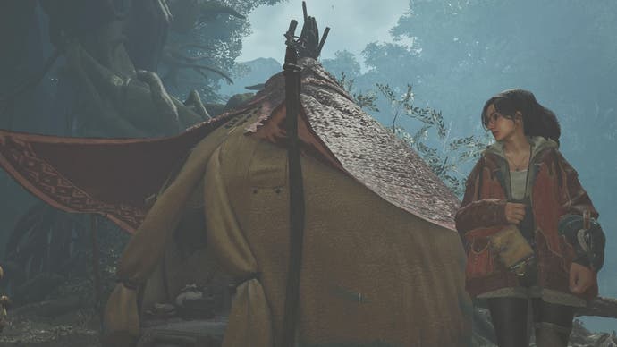 Alma standing beside a Pop-up Camp Tent in Monster Hunter Wilds.